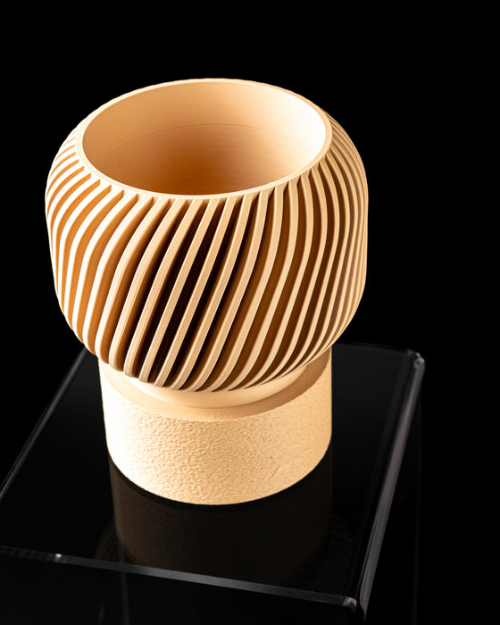 Side view of Rivo decorative planter with diagonal ribbing