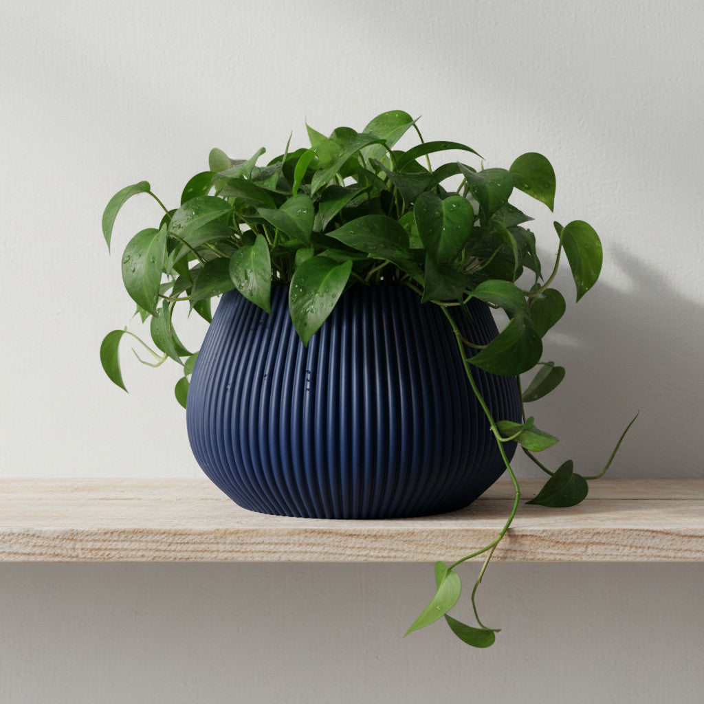Rivon deep vertical fluting with a balanced modern cylinder indoor planter, front view