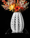 Seashell ribbed openwork vase styled with flowers
