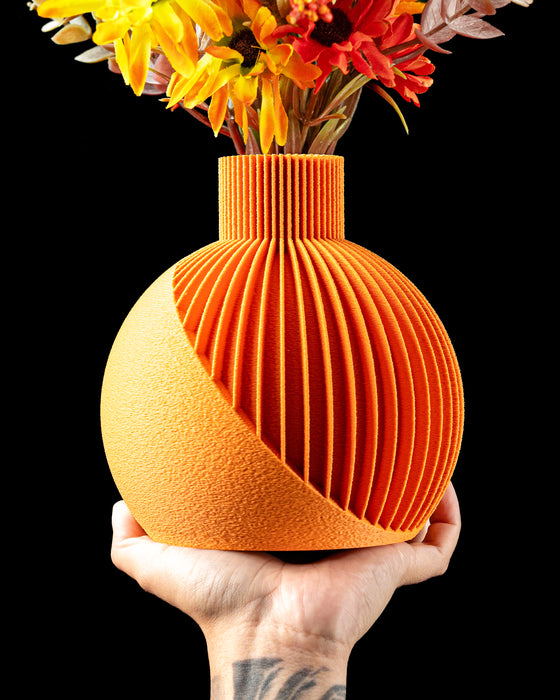 Solen sculptural ribbed vase with flowers, angled front view