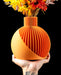 Solen sculptural ribbed vase with flowers, angled front view