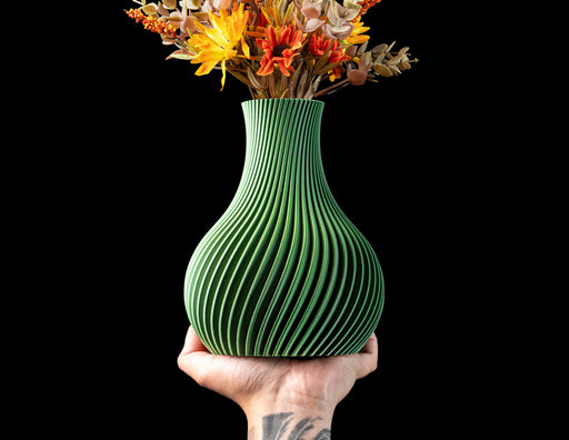 Sorel fluted round vase with sweeping spiral ribs and dried flowers