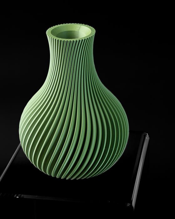 Angled view of Sorel ribbed vase with rounded body and narrow neck