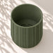 Empty Spigo herringbone wall planter viewed from above, showing the round opening and planting cavity.