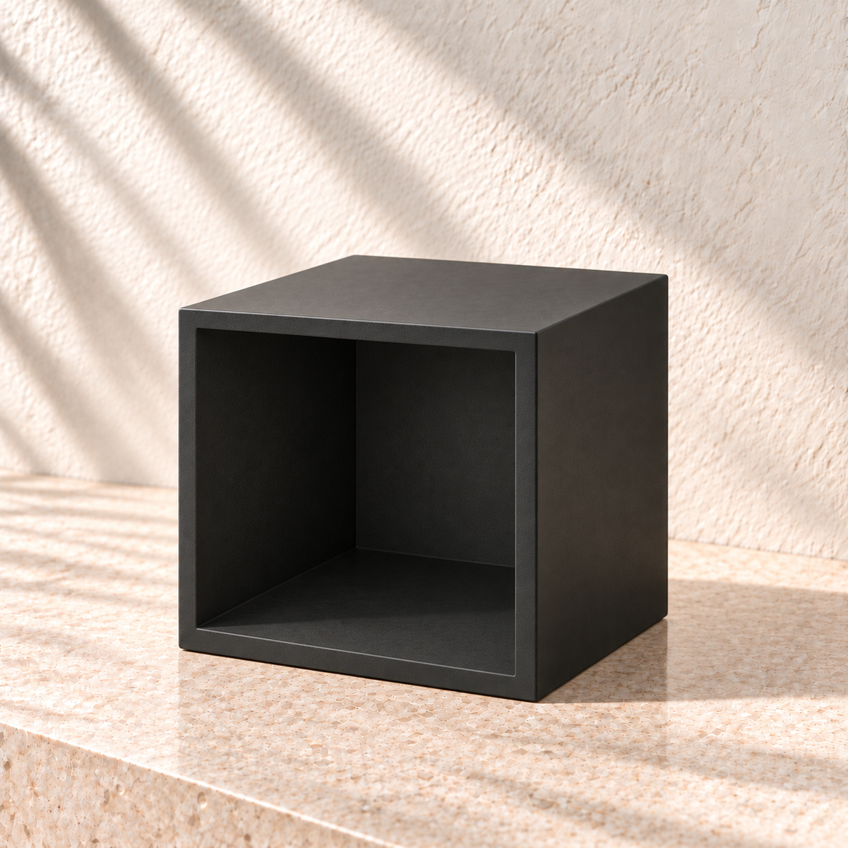 Square plant stand resting on its side to show its hollow open underside, side walls and closed top panel.