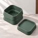 Design visualization of a Forest Green two-tier planter body with a visible central drain hole on the left and its detached lower-tier tray at the front-right.