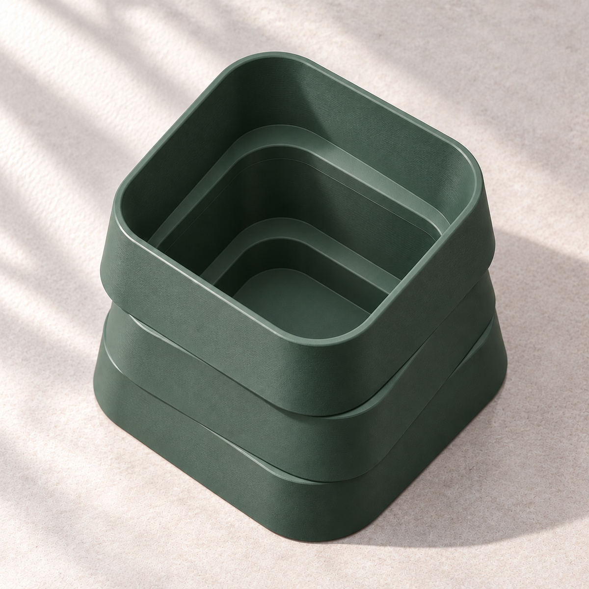 Design visualization looking down into an empty Forest Green no-drainage planter, showing the deep continuous interior through all three tiers and its closed bottom.