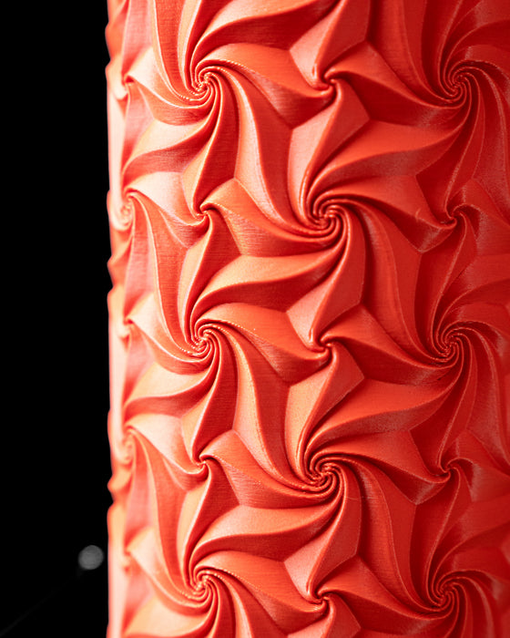 Close-up of Swirl vase repeating pinwheel surface texture