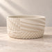 Product detail of the cream Tessaro shallow bonsai planter and its patchwork-textured design.