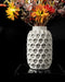 Trihex geometric hex-cell vase with flowers, front view