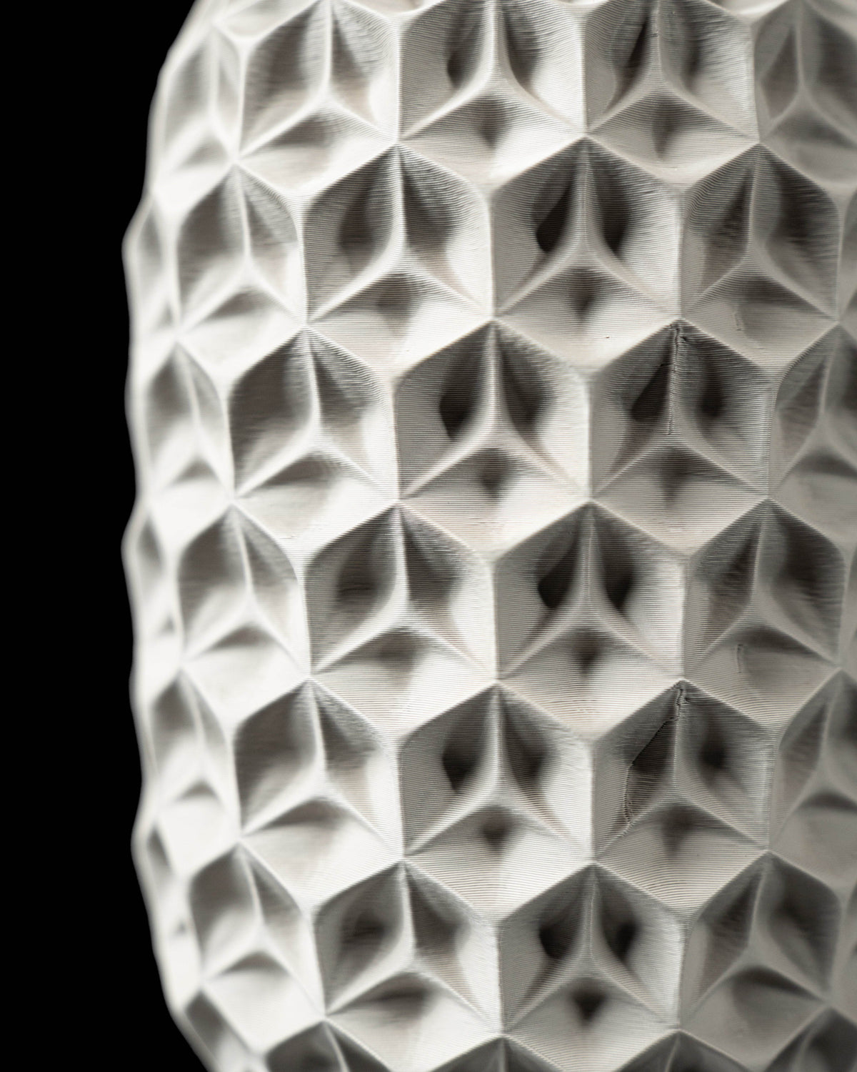 Close-up of Trihex vase faceted hex-cell texture