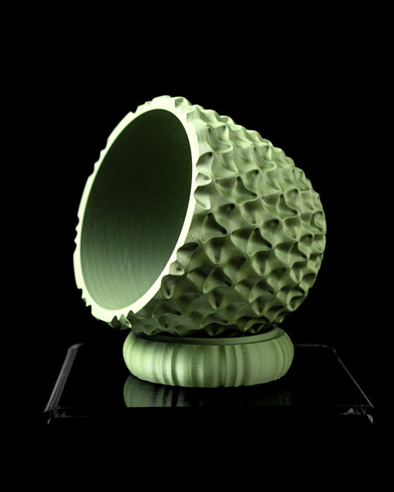 TriWave indoor planter tilted view showing opening and sculptural texture