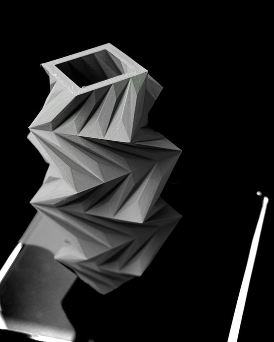 Twis vase angled top view showing square opening