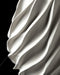 Close-up of Twisted vase sweeping spiral flutes