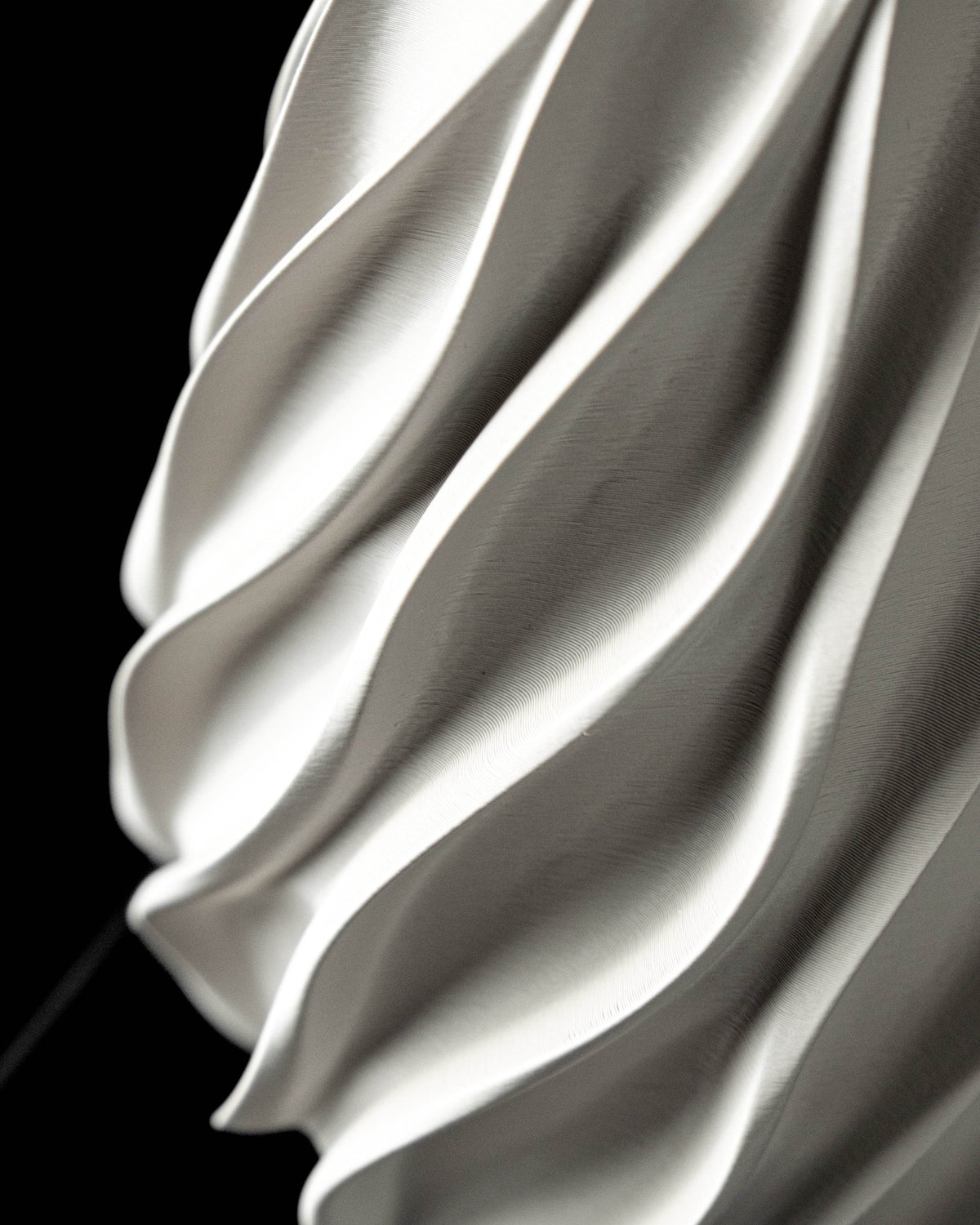 Close-up of Twisted vase sweeping spiral flutes