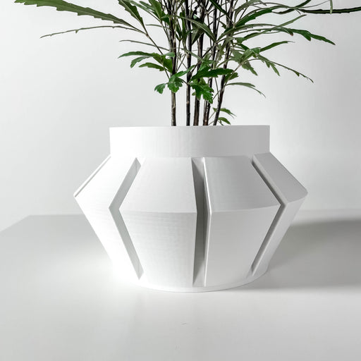 Futuristic geometric 3D printed planter with angular faceted body, modern designer flower pot for contemporary home decor