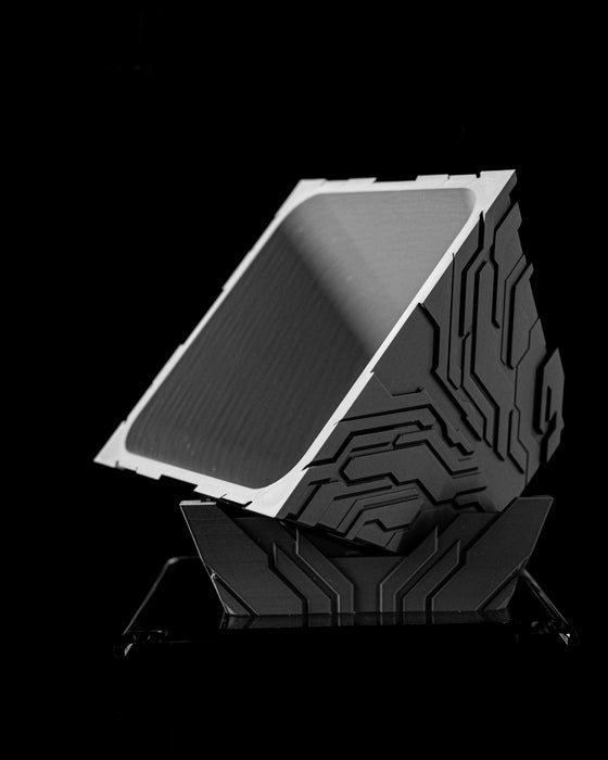 Uplink geometric planter tilted view showing square opening and raised circuit relief