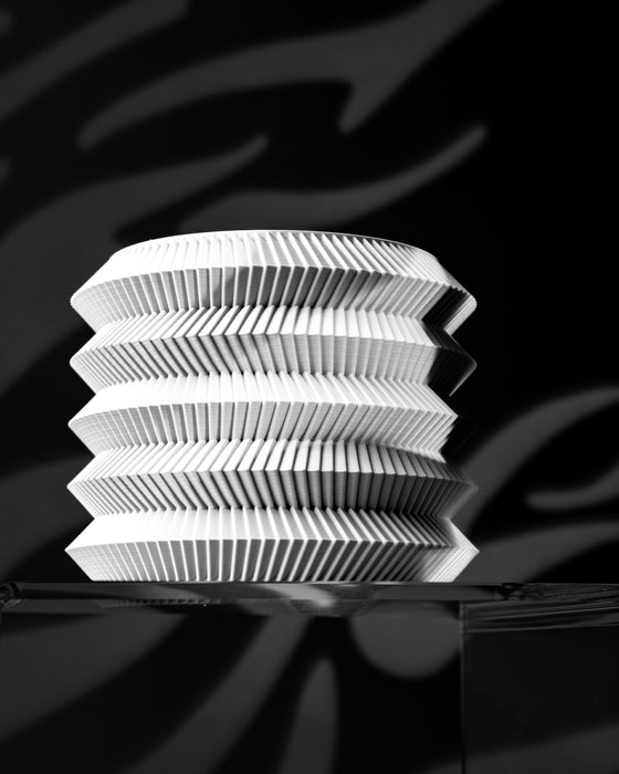 Varo sculptural stacked ribbed planter on display stand