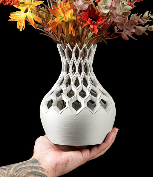 white 3d printed vase with hollow lattice neck and smooth rounded base, sculptural modern design for dried flowers or decorative stems