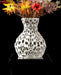 3d printed vase featuring a perforated geometric pattern reminiscent of cellular or porous textures, with a rounded base and a slightly narrowed neck; the surface is evenly pierced with oval and irregular openings that bring visual lightness and intricate detailing; ideal for dried flowers, decorative stems, or curated floral arrangements; the form suggests both chaos and structure, echoing coral reefs.