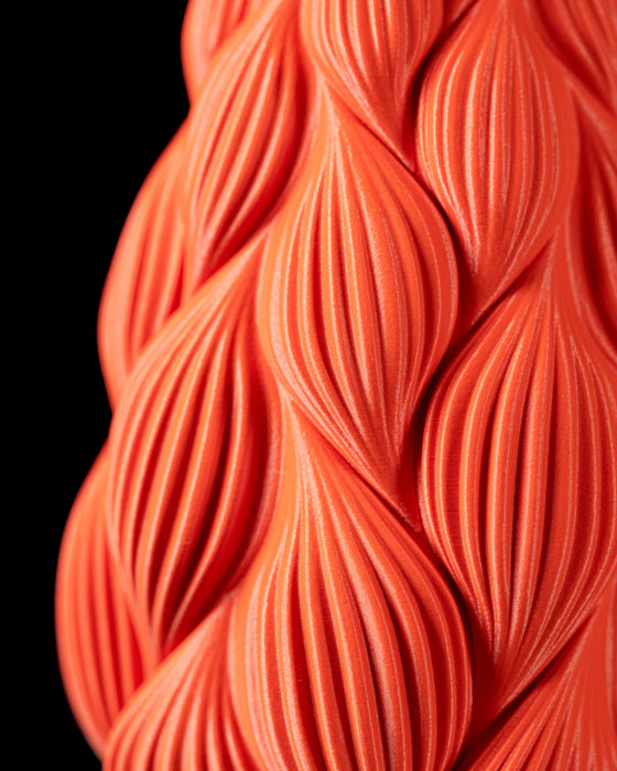 top-down view of tall vase with teardrop relief pattern and circular opening, artistic 3d printed vessel for flower arrangements