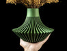 angled front view of green sculptural vase with dramatic ribbed base and smooth vertical neck, minimalist aesthetic for modern interiors