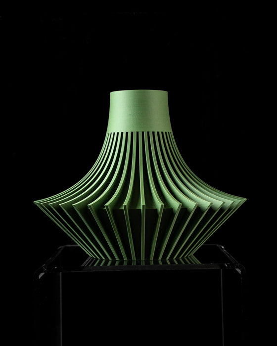 side view of artistic green flower vase featuring wide fluted bottom and slim neck, perfect for dried flowers and modern home decor