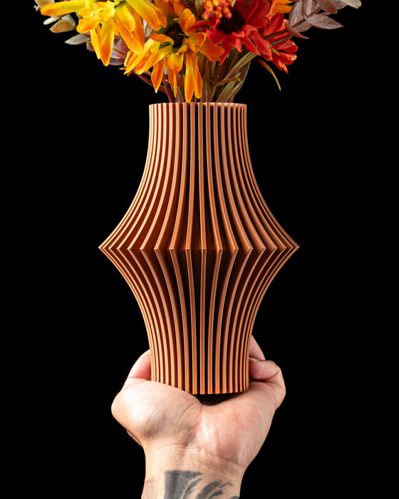 Vela flared ribbed vase with flowers, handheld front view