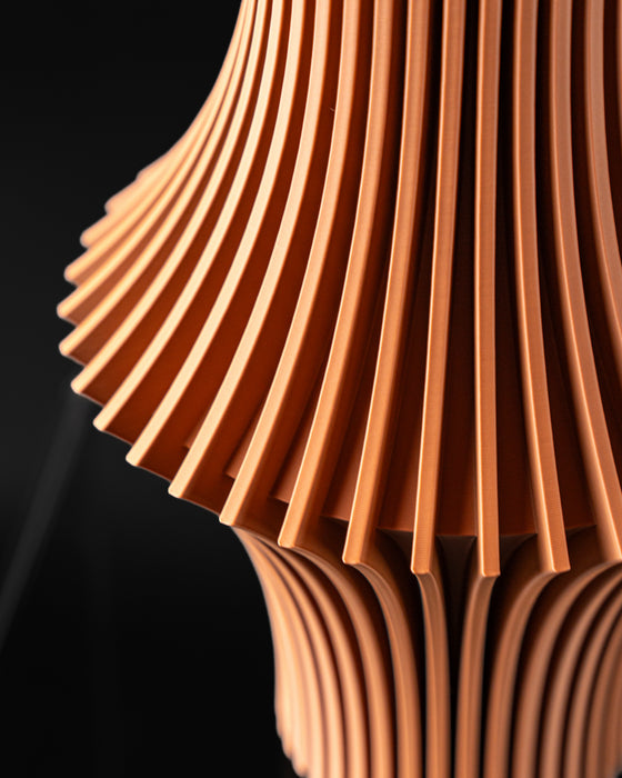 Vela flared ribbed vase close-up showing sculptural vertical fins