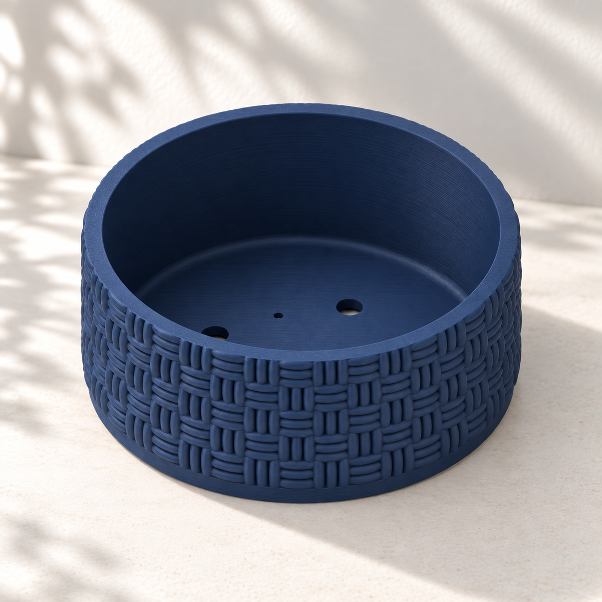 Empty navy blue Vewo bonsai bowl without its detachable tray, showing the basketweave texture and drainage openings.