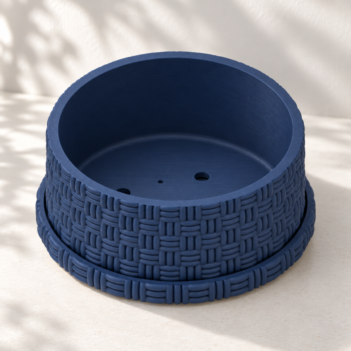 Empty navy blue basketweave bonsai pot on its matching tray, showing the shallow planting cavity.