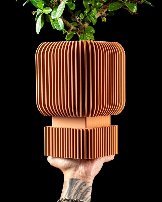 Vexo indoor planter with rounded square body and matching pedestal base