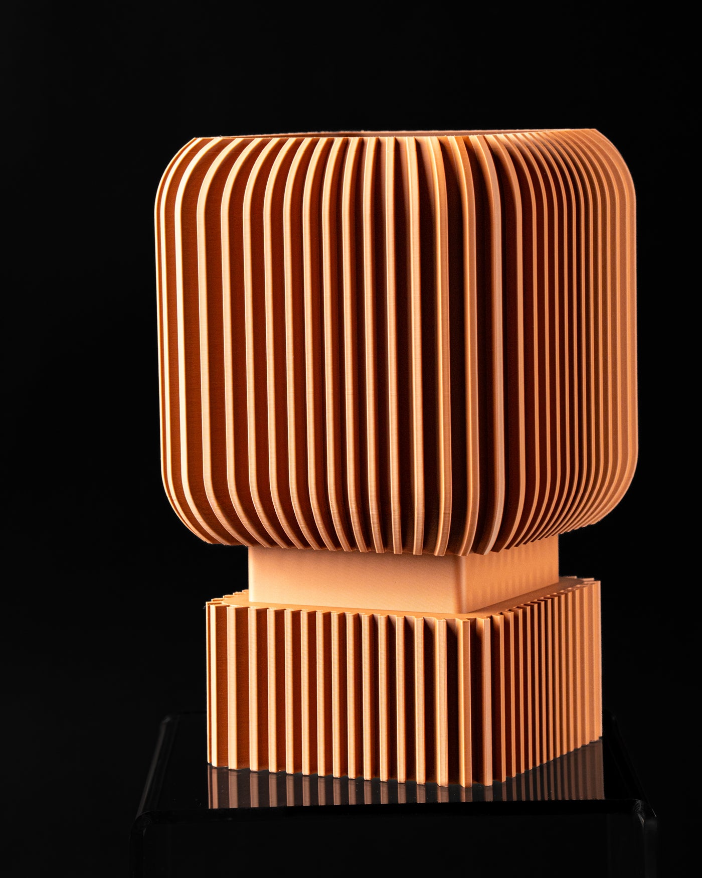 Front view of Vexo fluted square planter on pedestal base