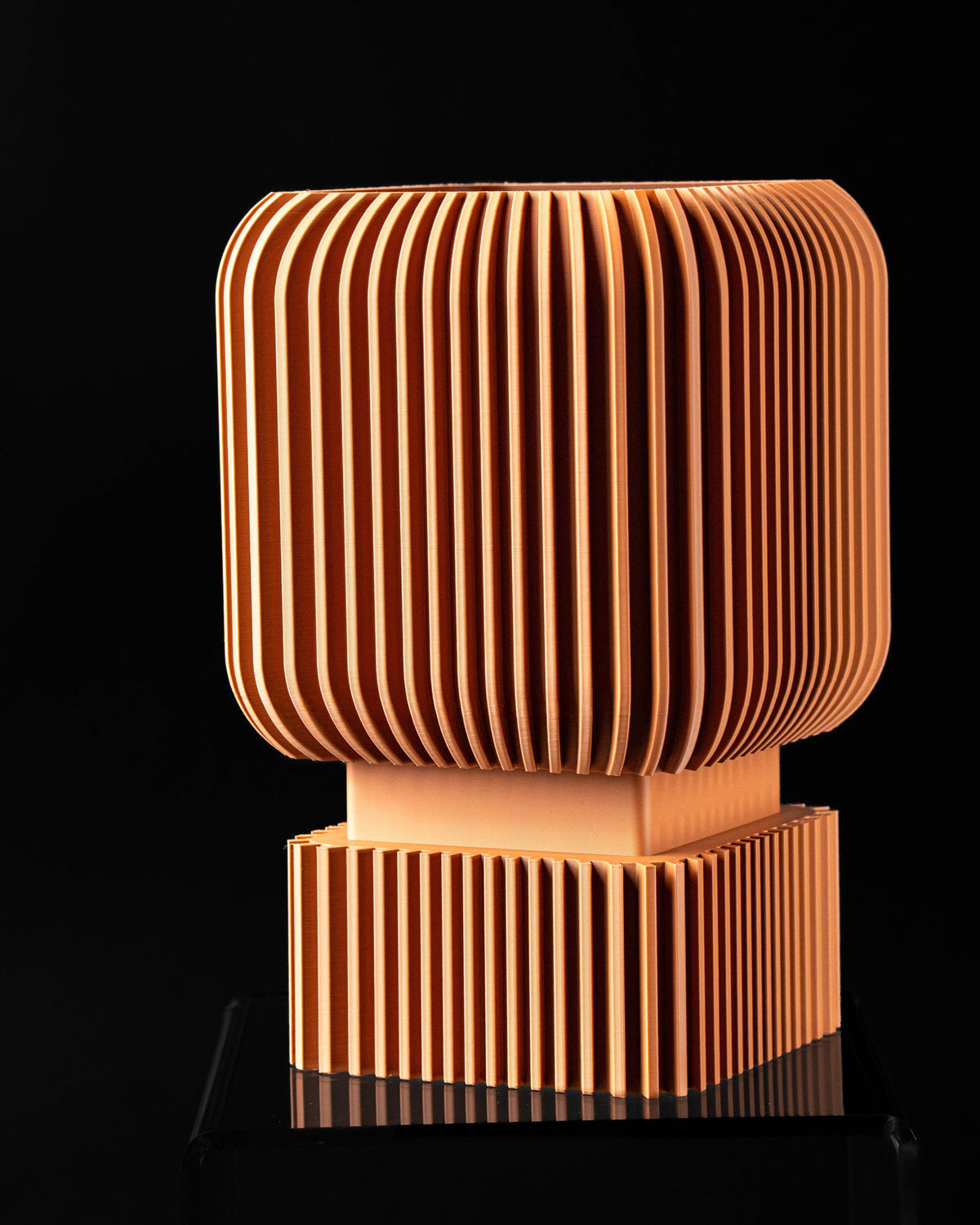 Front view of Vexo fluted square planter on pedestal base