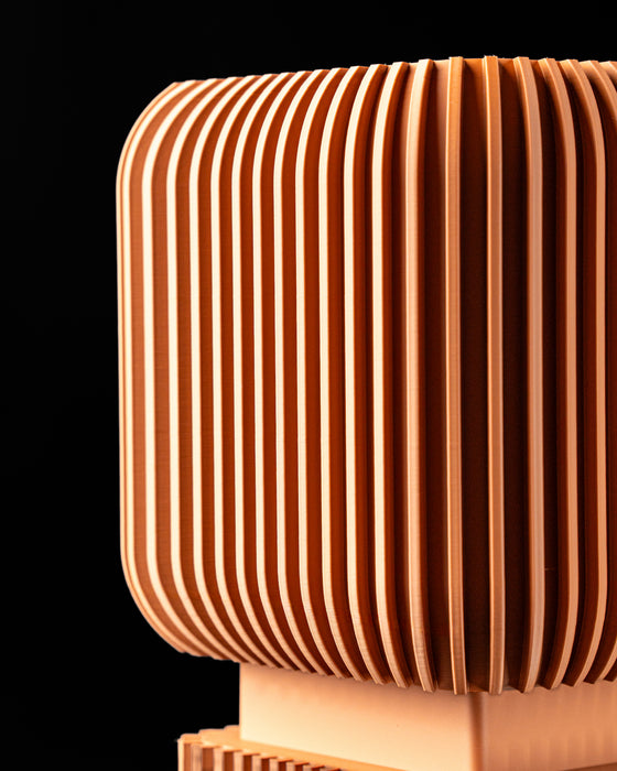 Detail of Vexo planter vertical flutes and pedestal connection
