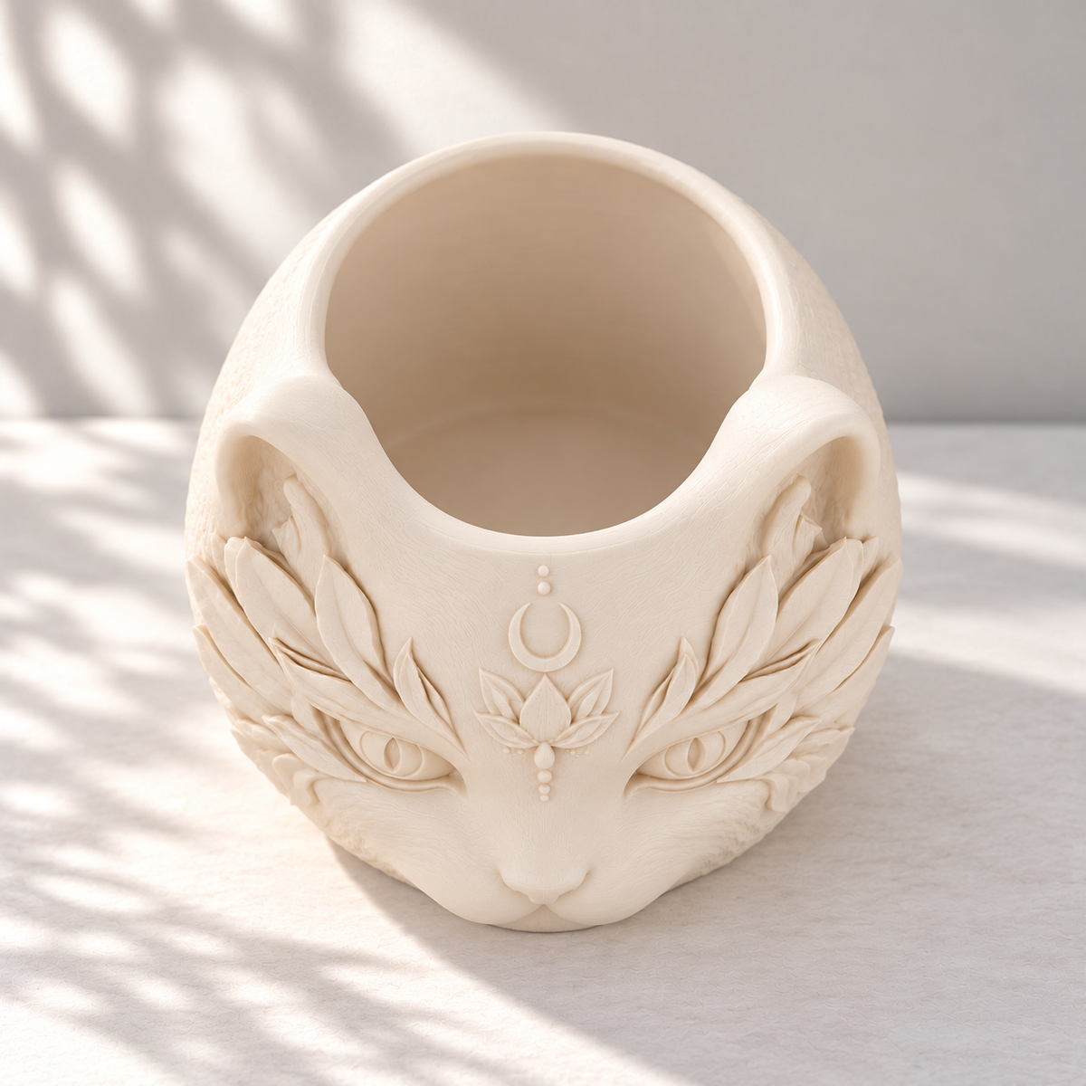 Top view of an empty cream white cat planter showing its open planting cavity and solid inner floor