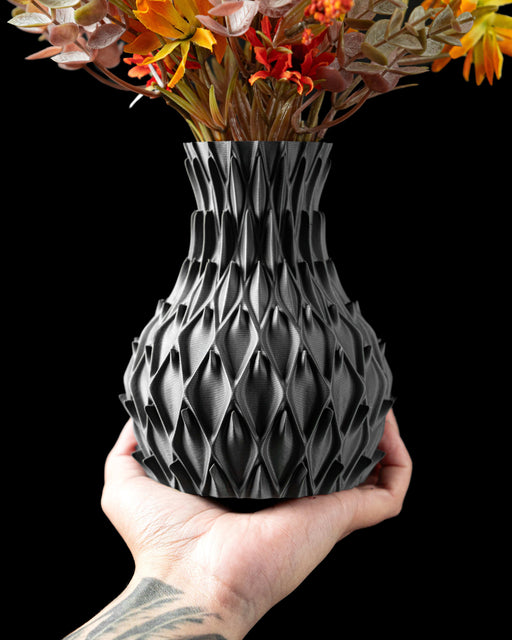black vase with rounded petal-like indentations evenly distributed across the surface, modern vase with intricate relief pattern, miniature flower vase for dried flowers or ikebana, 3d printed vase with sculptural texture and personalized design, unique gift and home office decor, vases for flowers and unique home decor accent, aesthetic vase with a symmetrical silhouette and matte surface finish