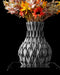 side view of black flower vase featuring deeply concave petal-shaped grooves, aesthetic vase with symmetrical geometry and smooth curved body, miniature black vase ideal for dried flowers or ikebana, personalized vase as unique gift or home office decor, modern sculptural 3d printed vase, contemporary vases for flowers and artistic interiors
