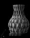 angled view of black 3d printed vase showing detailed petal-like surface structure, miniature flower vase with round mouth and concave wall relief, personalized vase for ikebana arrangements or dried flowers, unique home decor and home office accessory, black vase as a modern design element and unique gift