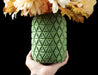 stylish green miniature vase with flowing interwoven strips forming a symmetrical organic mesh, perfect for decorative dried flower arrangements or personalized gifts, 3d printed vase ideal for modern interiors and unique home decor displays