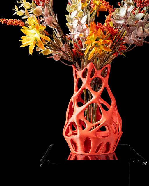 orange flower vase with openwork organic design and parametric geometry, 3d printed vase for dried flowers or sculptural arrangements, modern flower vase with interconnected openings and matte surface, unique home decor piece with futuristic coral-like structure, personalized vase for contemporary interiors and creative gift ideas, vases for flowers, dried stems, or ikebana compositions, aesthetic vase with lightweight lattice body and fluid silhouette