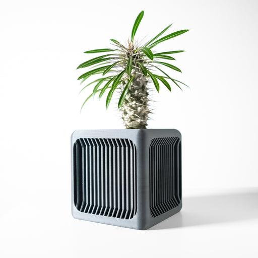 Modern square 3D printed planter pot with vertical slotted texture on all four sides, clean sharp edges, and gently flared top, made from eco-friendly PLA plastic, suitable for desktops and side tables