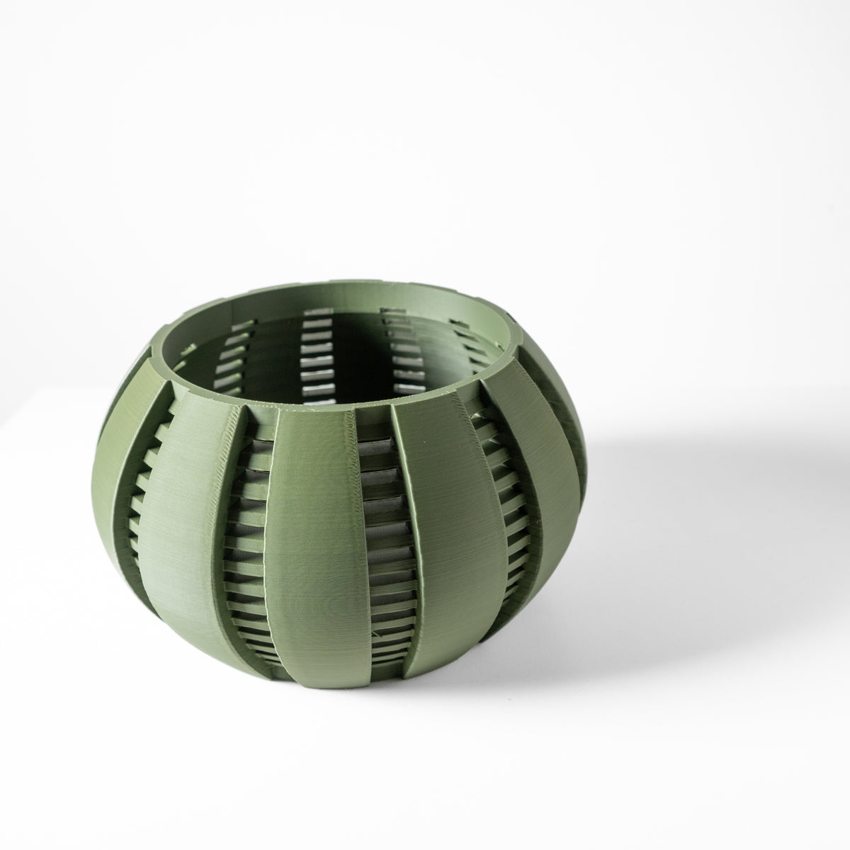 Arik curved open slats ventilated orchid pot, indoor display view