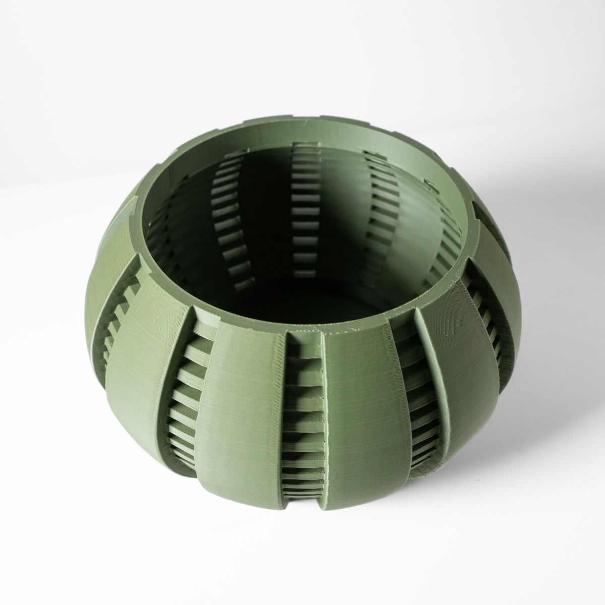 Arik curved open slats ventilated orchid pot, front view