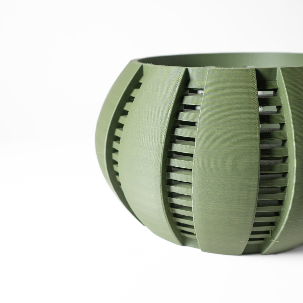 Arik curved open slats ventilated orchid pot, side view