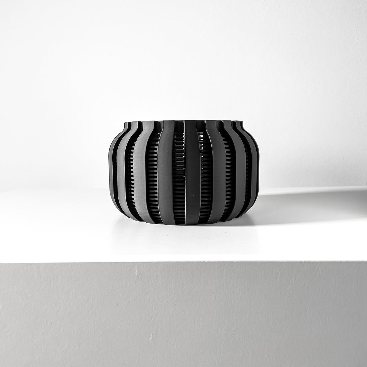 Avix ventilated orchid pot with rounded ribs, front view of empty pot