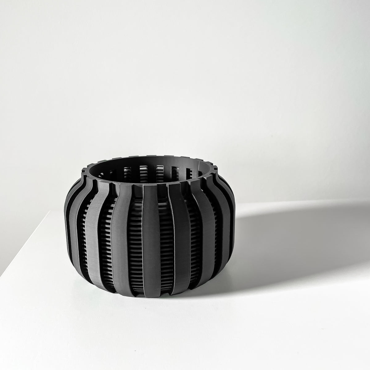 Avix ventilated orchid pot with rounded ribs, angled view of empty pot
