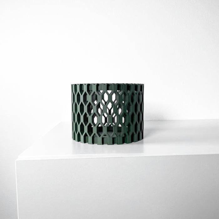 Sculptural orchid pot in dark green, designer planter with airflow-enhancing structure for orchids or succulents.