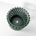 Vertical garden orchid planter in green, compact and eco-friendly 3D printed pot with geometric cutouts.