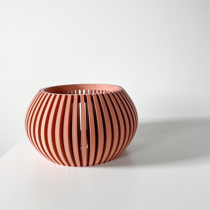 Close-up of a modern peach 3D printed orchid pot with a ribbed design, featuring a drainage hole and tray. This planter is ideal for providing a healthy environment for your orchids and other indoor plants.